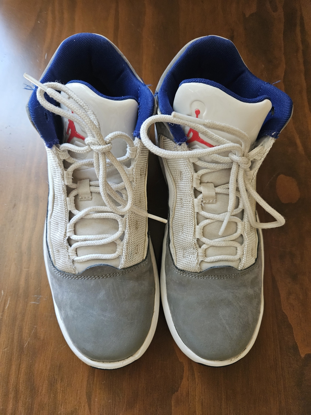 Jordan Men’s Grey, White and Blue Basketball Sneakers with Red Logo